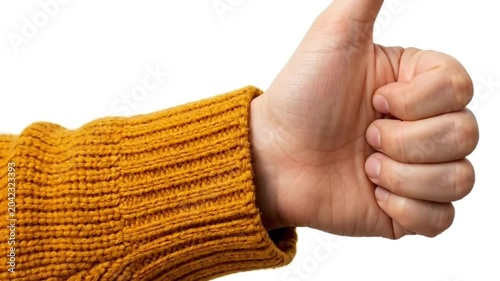 Close-up of hand showing thumbs up gesture in yellow knitted sweater isolated on clean white background. Minimalist aesthetic, commercial videography, high definition, bright lighting, dynamic zoom.