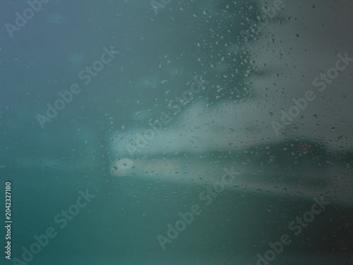 Moody dark slate blue abstract background with a subtle overlay texture of fine rain droplets