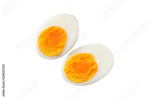 Принти на полотні Two cracked raw eggs with bright orange yolks on white background minimalist foo