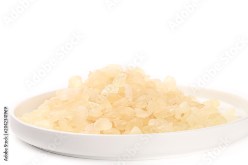 Bild auf Leinwand Rock Sugar Crystals on White Plate - Traditional Asian Sweetener