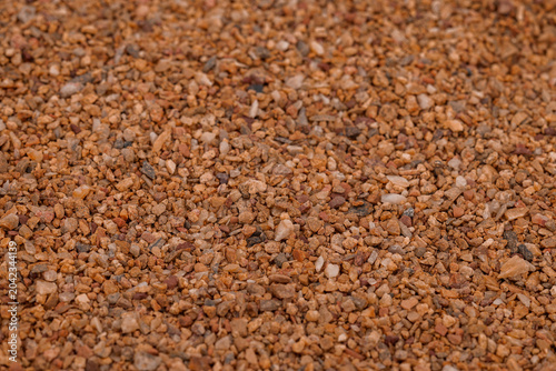 Foto Close-Up Brown Gravel Texture Background of Small Pebbles and Crushed Stone for