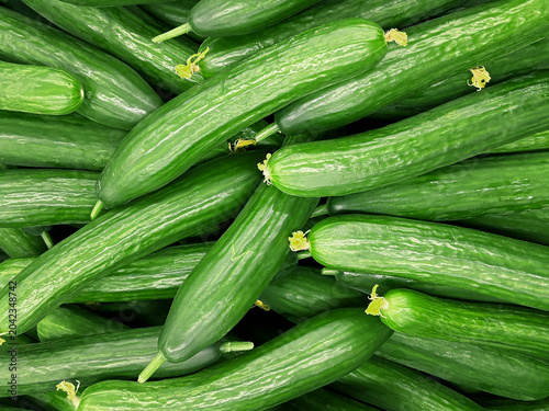 Fresh Green Cucumbers On The Counter In A Market