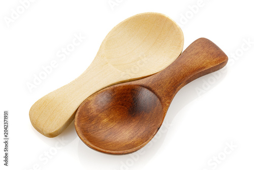 Small wooden spoon for spice isolated on white background. Close-up