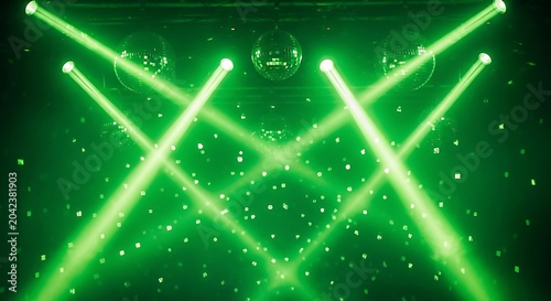 Vibrant green stage lights crisscross, illuminating a dark space with disco balls