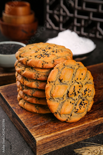 Old-Fashioned Sesame Seed Cookies on Wooden Board