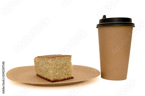 A slice of homemade pie on a craft plate. And a craft coffee cup.