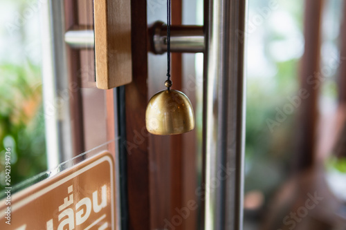 Tablou pe pânză Bell chiming at  entrance tranquil garden setting photograph rustic ambiance clo