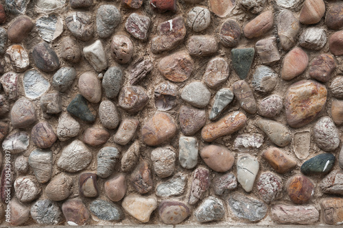 Stone pebble texture creates rustic wall background