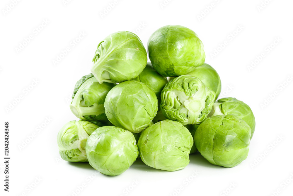 Fototapeta premium Fresh Green Brussels Sprouts Pile Isolated on White Background - Healthy Organic Vegetables