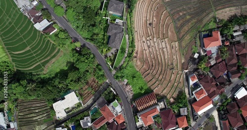 Bali faces challenges from rapid development affecting agriculture and water supply amidst beautiful green landscapes