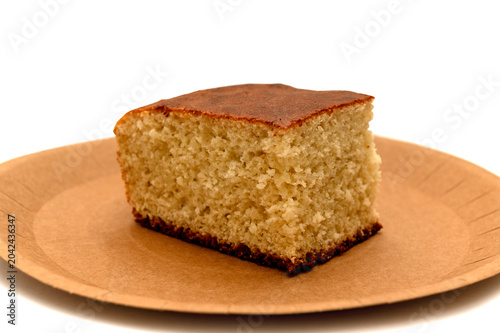 A slice of homemade pie on a craft plate. Top view.