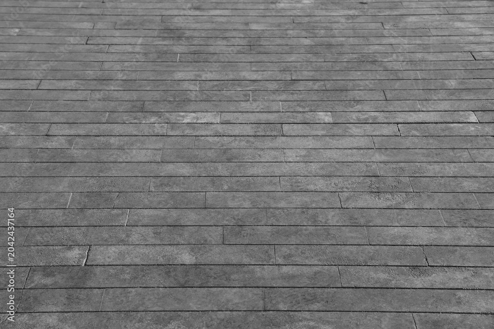 Fototapeta premium empty stone floor top in perspective. grey tile floor background in perspective view. line. empty copy space stone street. pavement. Granite outdoor tiled floor. gray granite. Marble texture