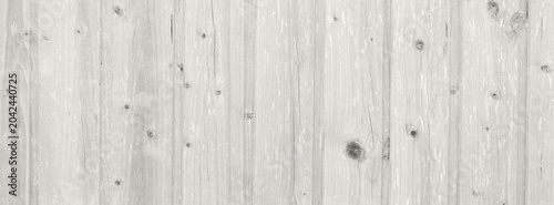 Whitewashed wooden plank background with rustic texture and faded paint for d...
