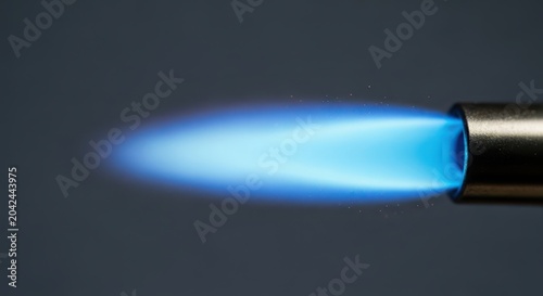 Detailed macro shot highlighting the intense concentrated blue jet flame produced by a modern, durable, and essential heating tool, safety, modern, precise