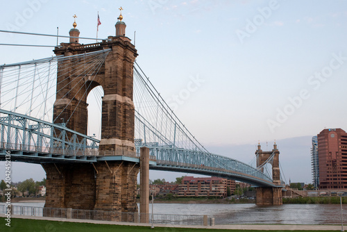 The iconic John A. Roebling suspension bridge during the day.