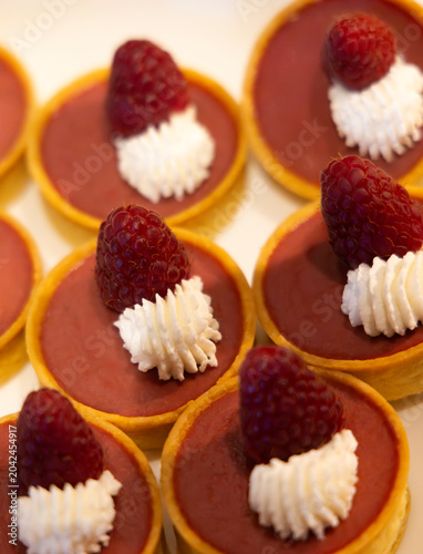 Photos Creamy Raspberry Tarts are tempting tidbits for baked dessert treats in bite siz