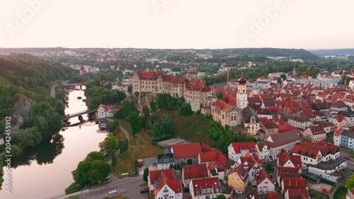 Sunrise aerial drone view of a hilltop fortress in Germany. Panoramic scenery of Schloss Sigmaringen and old town in Baden-Wuerttemberg