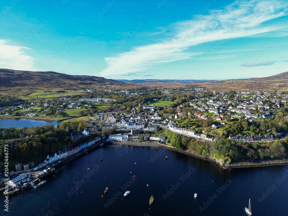 Fototapeta premium Aerial View of Portree Harbour and Colourful Waterfront Buildings, Isle of Skye, Scottish Highlands, Scotland