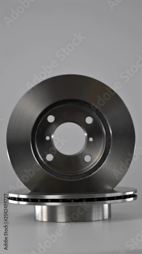 A close-up of new brake discs on a white background.