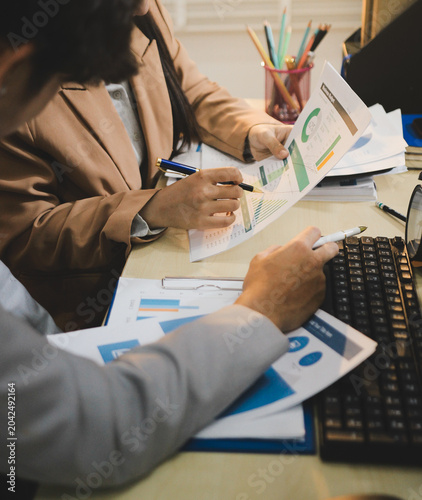 Business accounting concept, Business man using calculator with computer laptop, budget and loan paper in office.