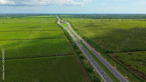 Aerial View of Modern Highway Surrounded by Greenery at Sunset