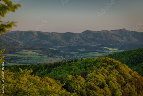 Bild auf Leinwand Green fresh spring landscape blue sky hot day Strazovske mountains and Sulov