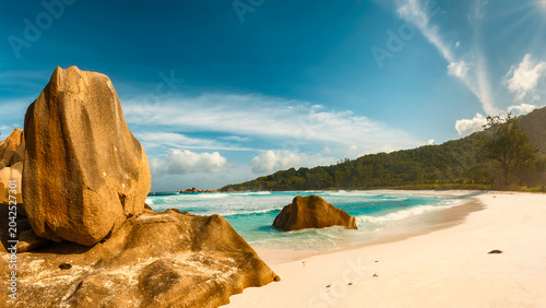 Sculpted granite boulders and turquoise water at Anse Cocos, La Digue, Seychelles