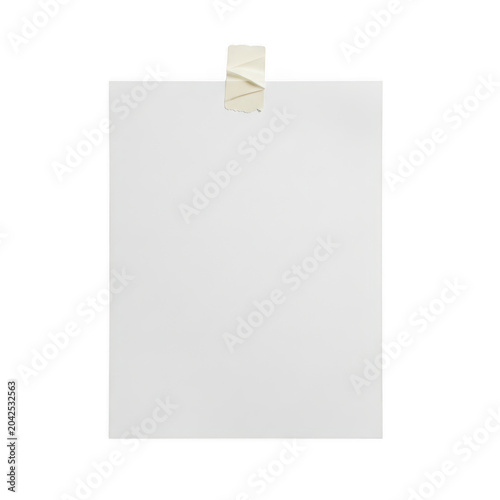 Golden clothespin holding a blank white paper