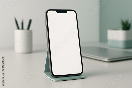 Modern smartphone with blank white screen on a stand on a minimalist