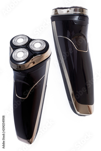 Two views of a cordless rotary electric shaver isolated on a white background. Men's grooming. Beard trimmer
