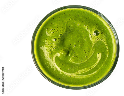 Fresh green vegetable smoothie in glass top view showing vibrant colors and healthy detox drink texture