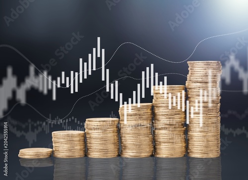 Savings concept, hand stacking gold coins