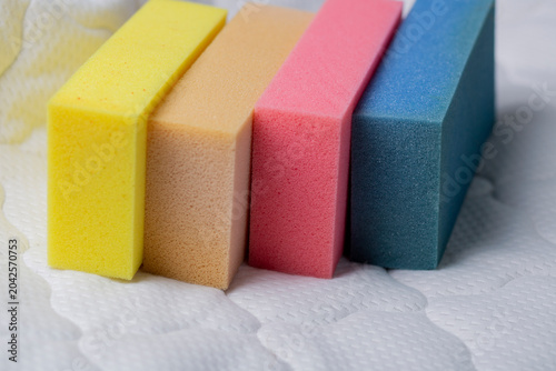 Fotografie Close-up of foam samples for mattresses in different colors and densities
