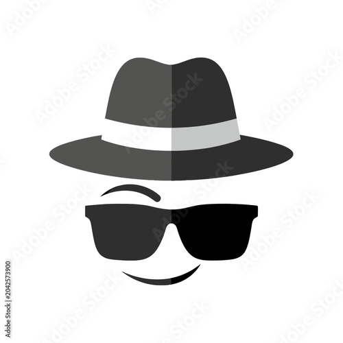 A smiling face with sunglasses and a hat, a symbol of mystery and anonymity