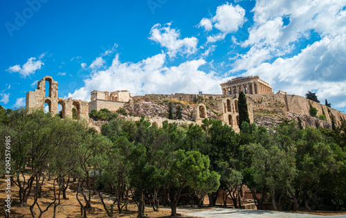 The Acropolis of Athens rising above olive trees as seen from Dionysiou Areopagitou Street in early May, capturing the blend of ancient monument and urban greenery. 2