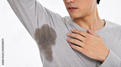 Young Man with Excessive Underarm Sweat Stain on Shirt