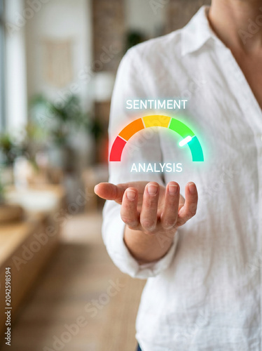 Sentiment analysis real time feedback, hand holding color gauge in blurred room