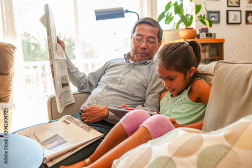 Reading newspaper Grandpa and Grandchild