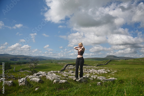 A teenage girl poses in the English Countryside