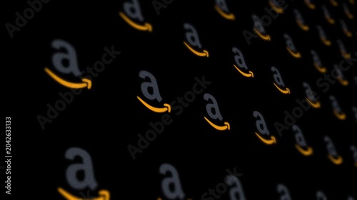 Amazon company logo icons in a digital grid background, editorial only