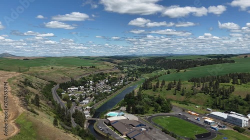 Aerial of Palouse River in Colfax Washington in spring small rural town