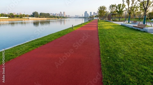 Red Running Track Along Serene Lake