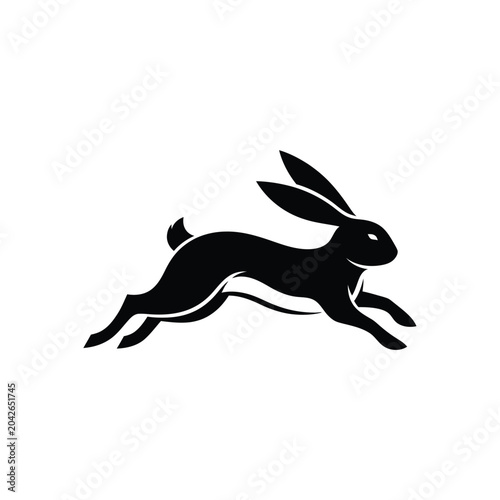 фотографія Black silhouette of a rabbit leaping forward with long ears
