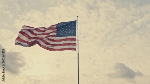 American flag waving on a cloudy day