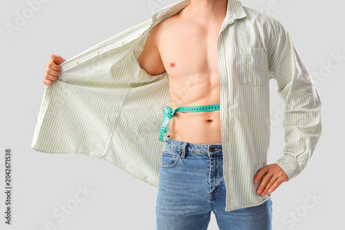 Male bodybuilder with tape ...
