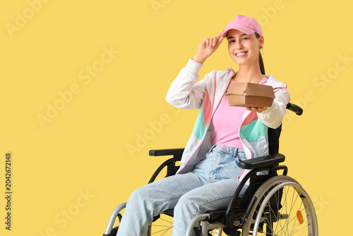 Female courier in wheelchai...