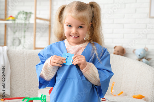 Cute little girl doctor at ...