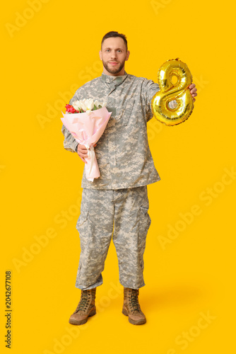 Young male soldier with bal...