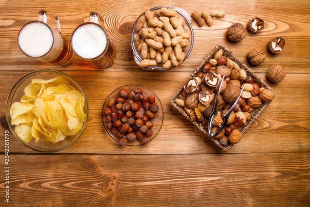 Fototapeta premium Healthy snacking with nuts and beer a delicious combination