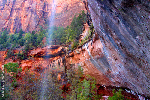 Waterfall flows into the Lower Emerald Pools of Zion National Park in Utah
